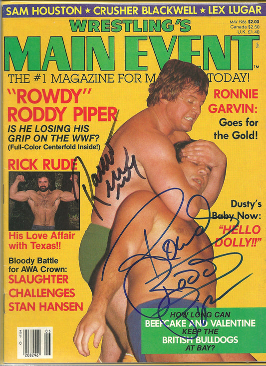 AM162  Rowdy Roddy Piper vs Ravishing Rick Rude ( Both Deceased ) Autographed Wrestling Magazine w/COA